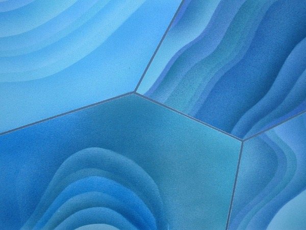 Blue decorative coating detail with flowing pattern